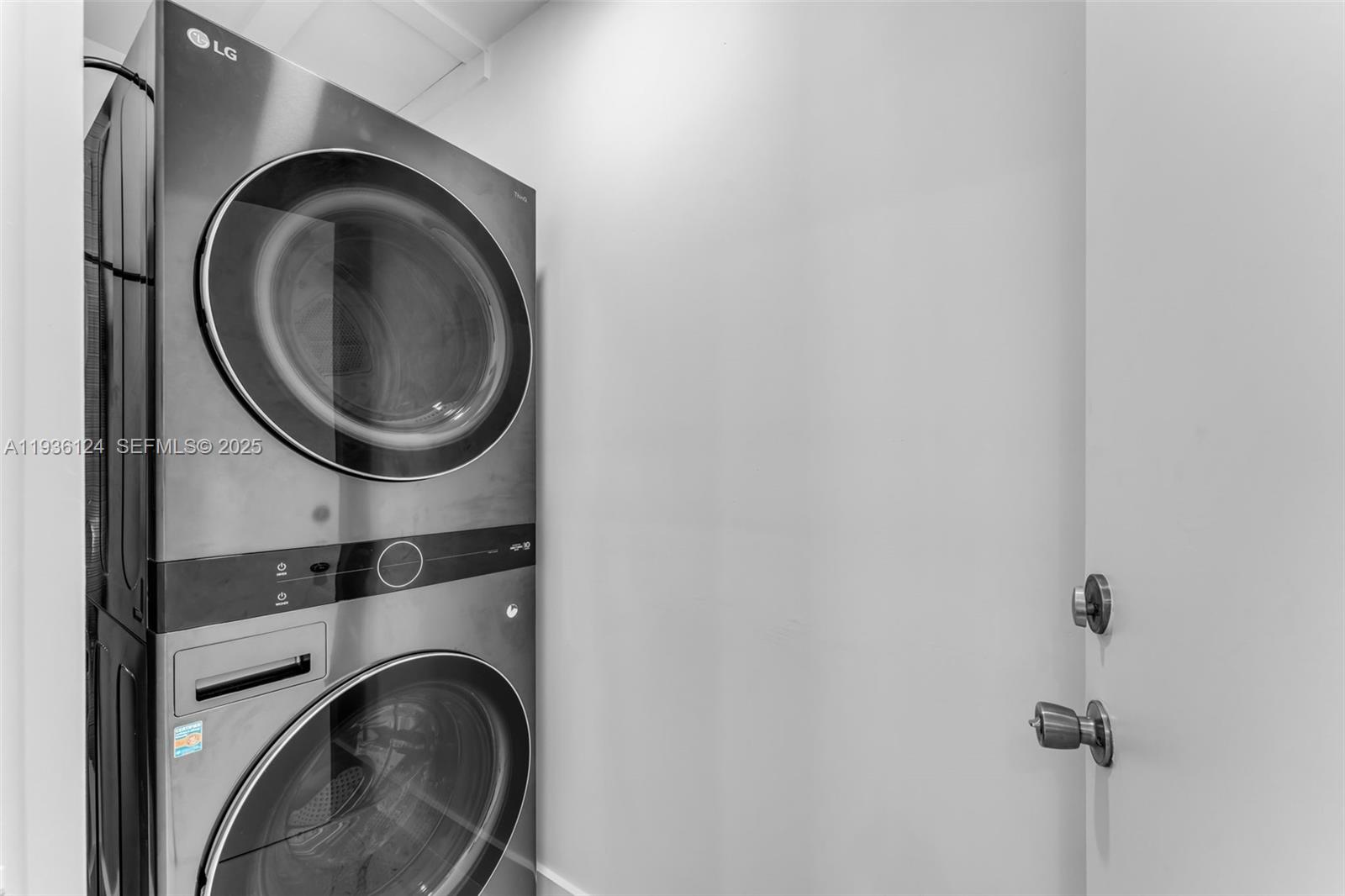 15042 Southwest 149th Court, Unit 1 Miami, FL 33196 - Photo 12 of 46 a close view of a utility room with dryer and washer