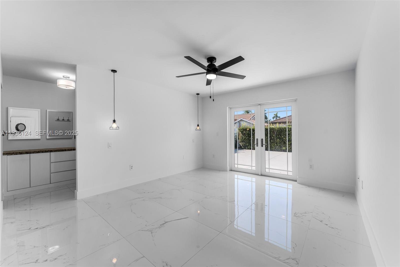 15042 Southwest 149th Court, Unit 1 Miami, FL 33196 - Photo 15 of 46 a view of an empty room with a window