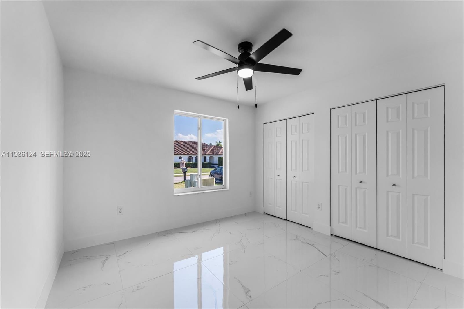 15042 Southwest 149th Court, Unit 1 Miami, FL 33196 - Photo 26 of 46 a view of an empty room with a window