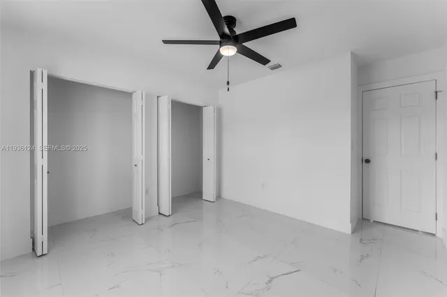 a view of a backyard with sitting area