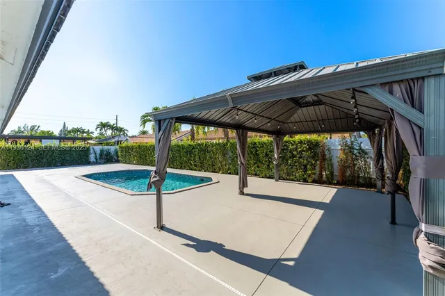 a view of backyard with green space