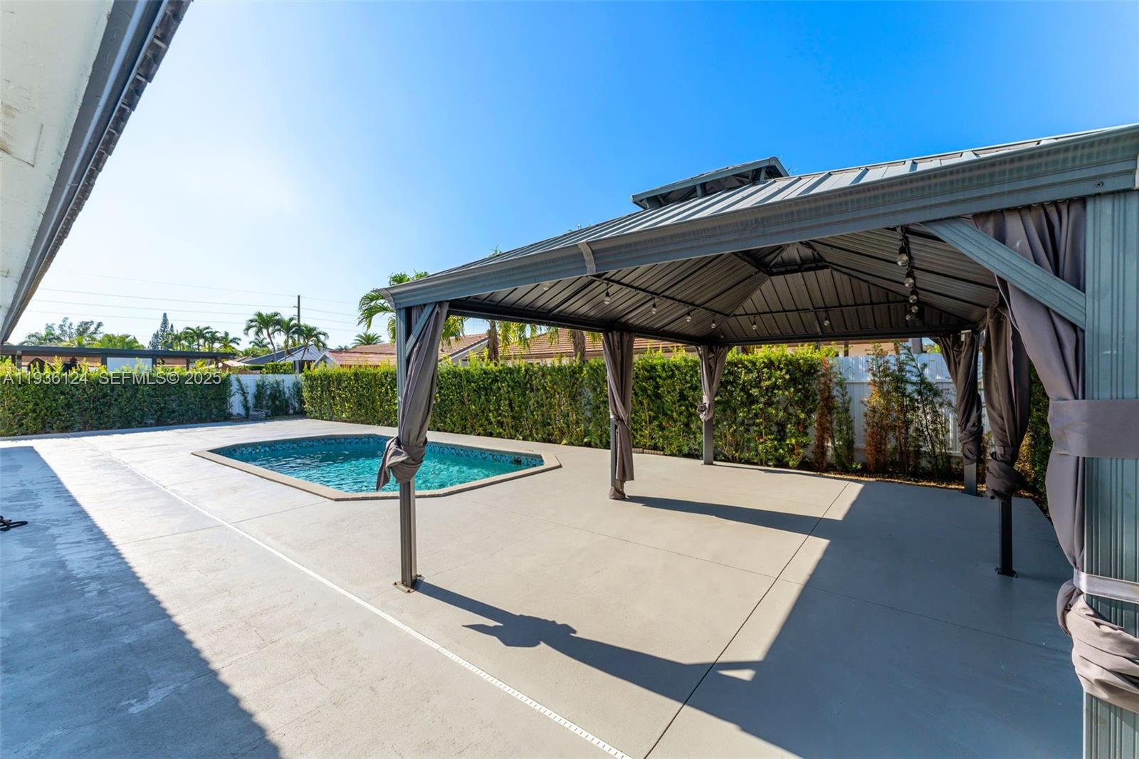 15042 Southwest 149th Court, Unit 1 Miami, FL 33196 - Photo 28 of 46 a view of a backyard with sitting area