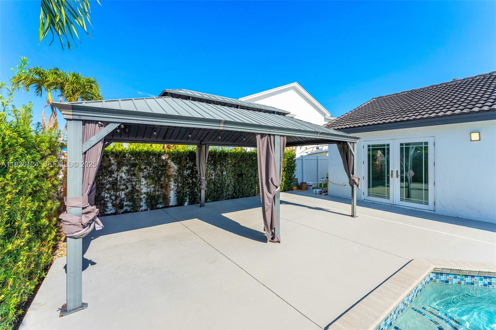 15042 Southwest 149th Court, Unit 1 Miami, FL 33196 - Photo 30 of 46 a house view with a garden space