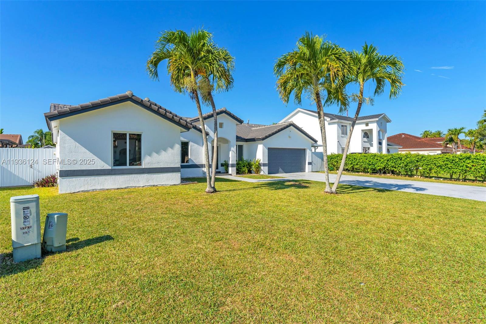 15042 Southwest 149th Court, Unit 1 Miami, FL 33196 - Photo 3 of 46 a front view of a house with swimming pool