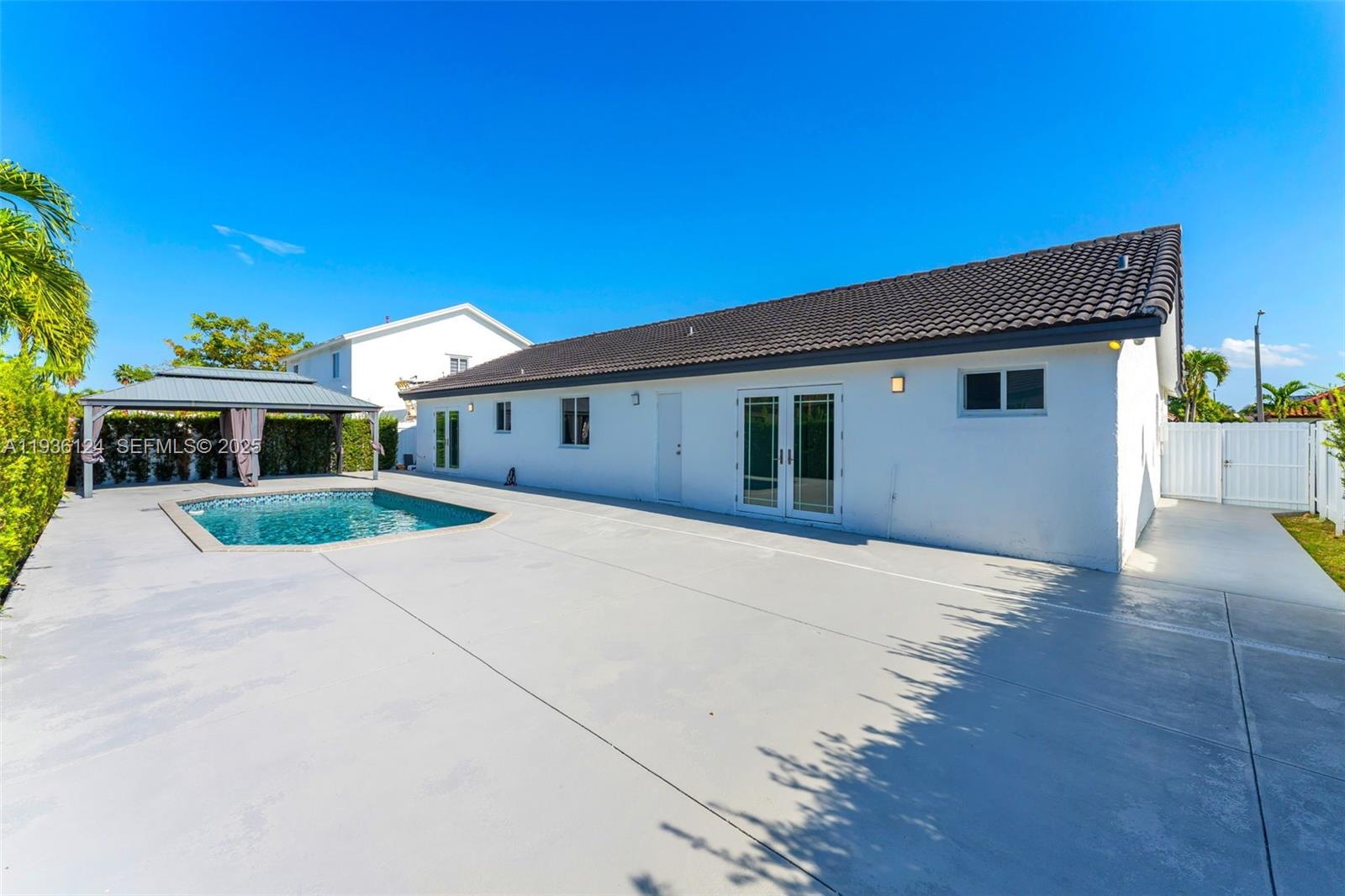 15042 Southwest 149th Court, Unit 1 Miami, FL 33196 - Photo 31 of 46 a front view of a house with yard and garage