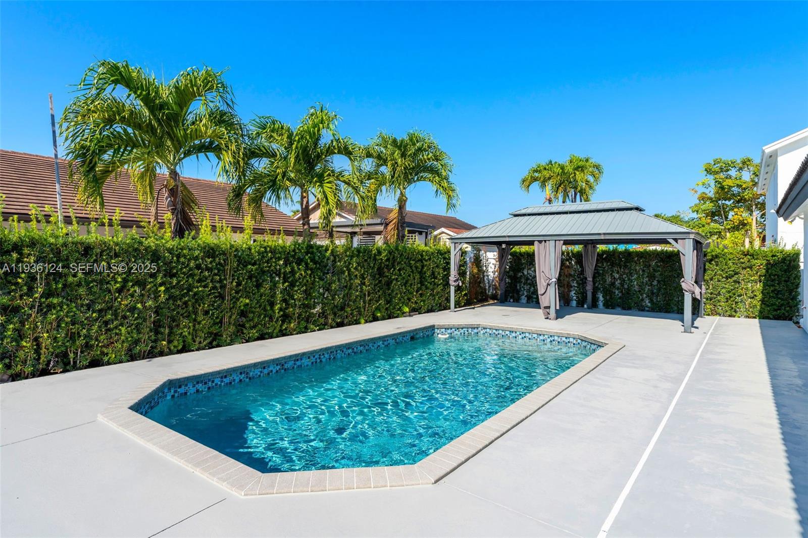 15042 Southwest 149th Court, Unit 1 Miami, FL 33196 - Photo 33 of 46 a view of a swimming pool with a yard