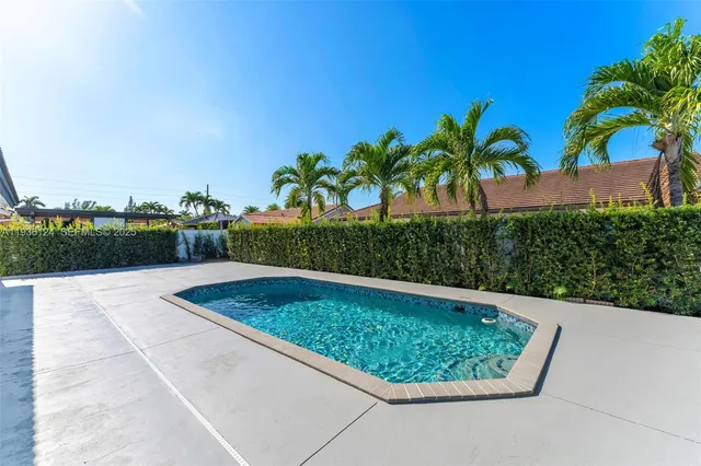 an aerial view of a house with outdoor space