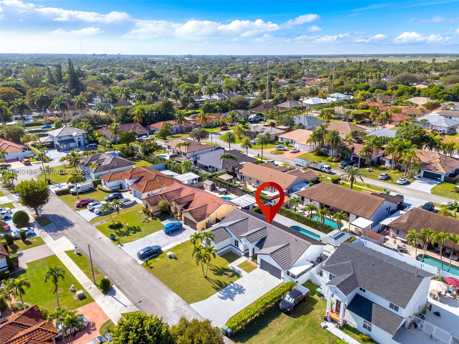 15042 Southwest 149th Court, Unit 1 Miami, FL 33196 - Photo 45 of 46 an aerial view of residential houses with outdoor space