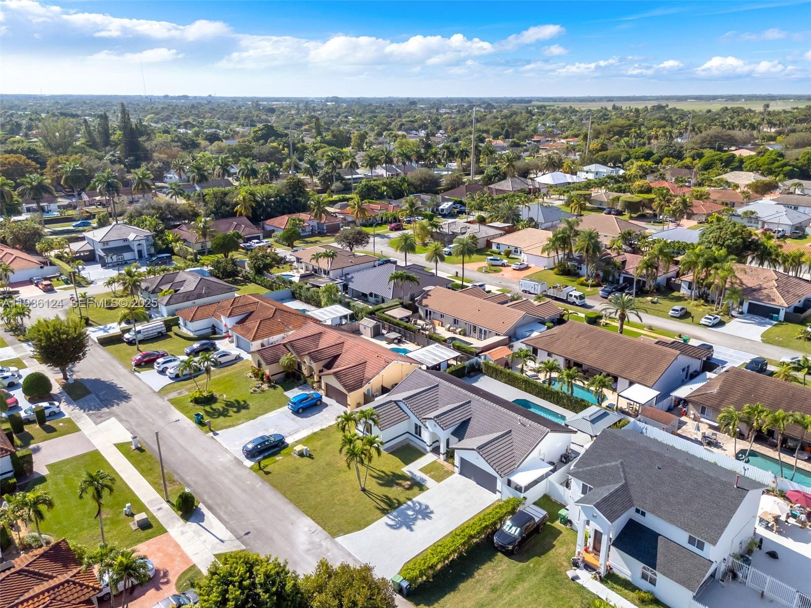 15042 Southwest 149th Court, Unit 1 Miami, FL 33196 - Photo 46 of 46 an aerial view of residential houses with outdoor space