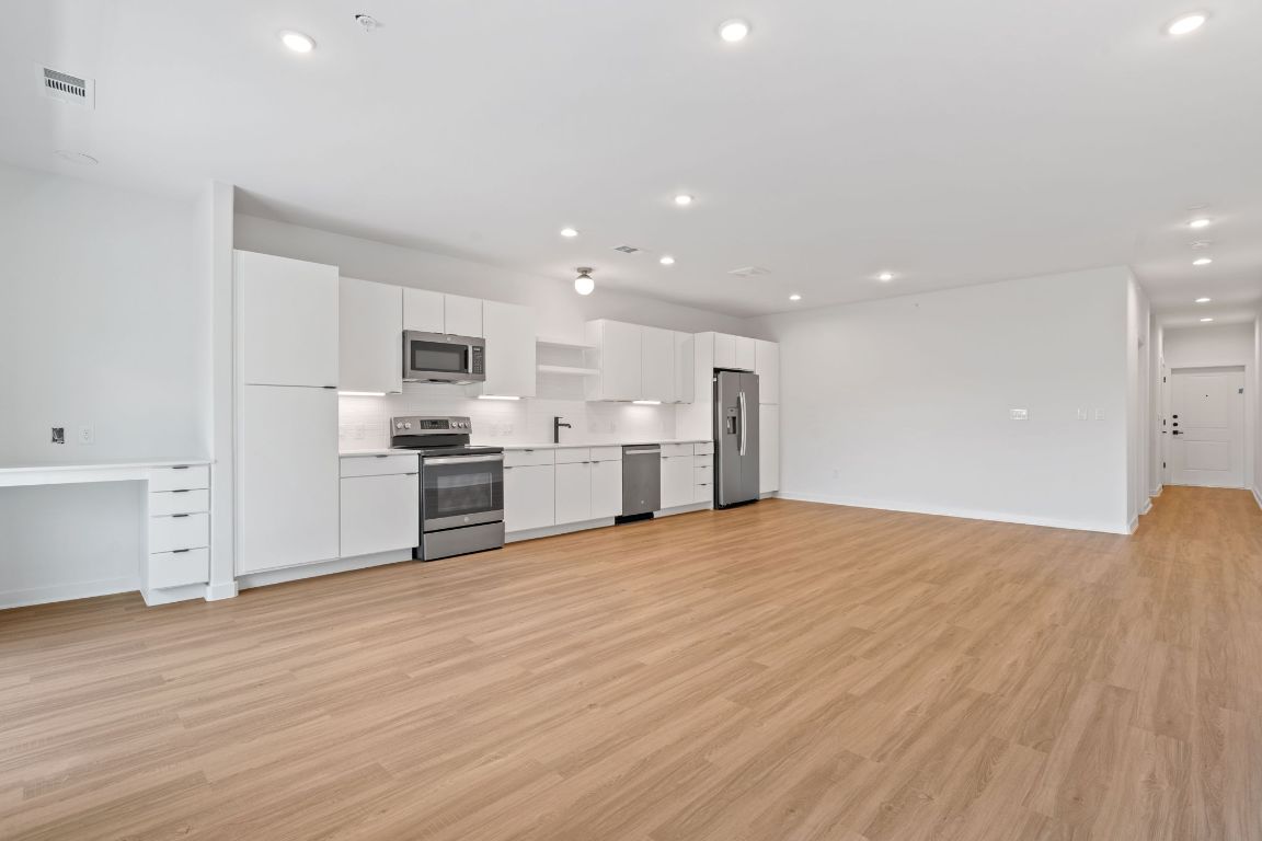 100 West Mockingbird Lane, Unit 307 Austin, TX 78745 - Photo 17 of 23 a view of kitchen with wooden floor