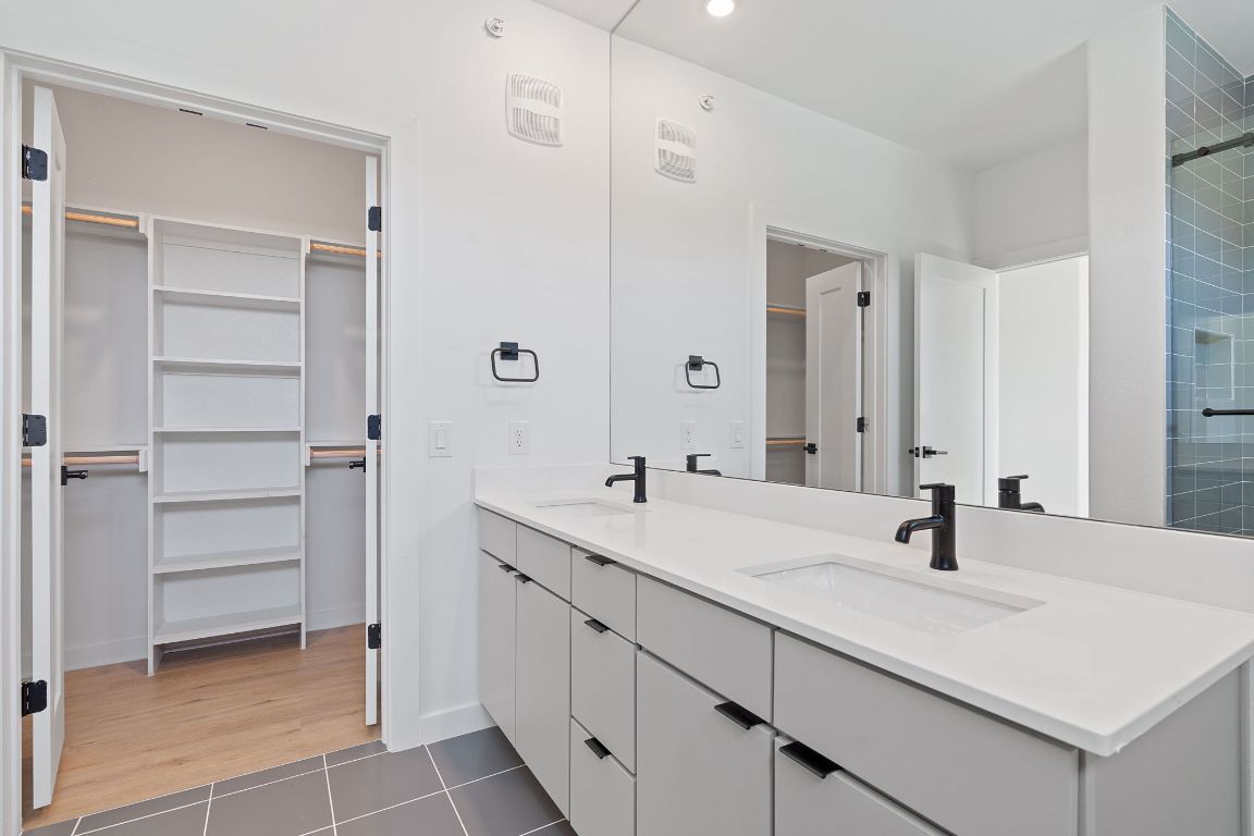 100 West Mockingbird Lane, Unit 307 Austin, TX 78745 - Photo 7 of 23 a bathroom with a sink and a mirror