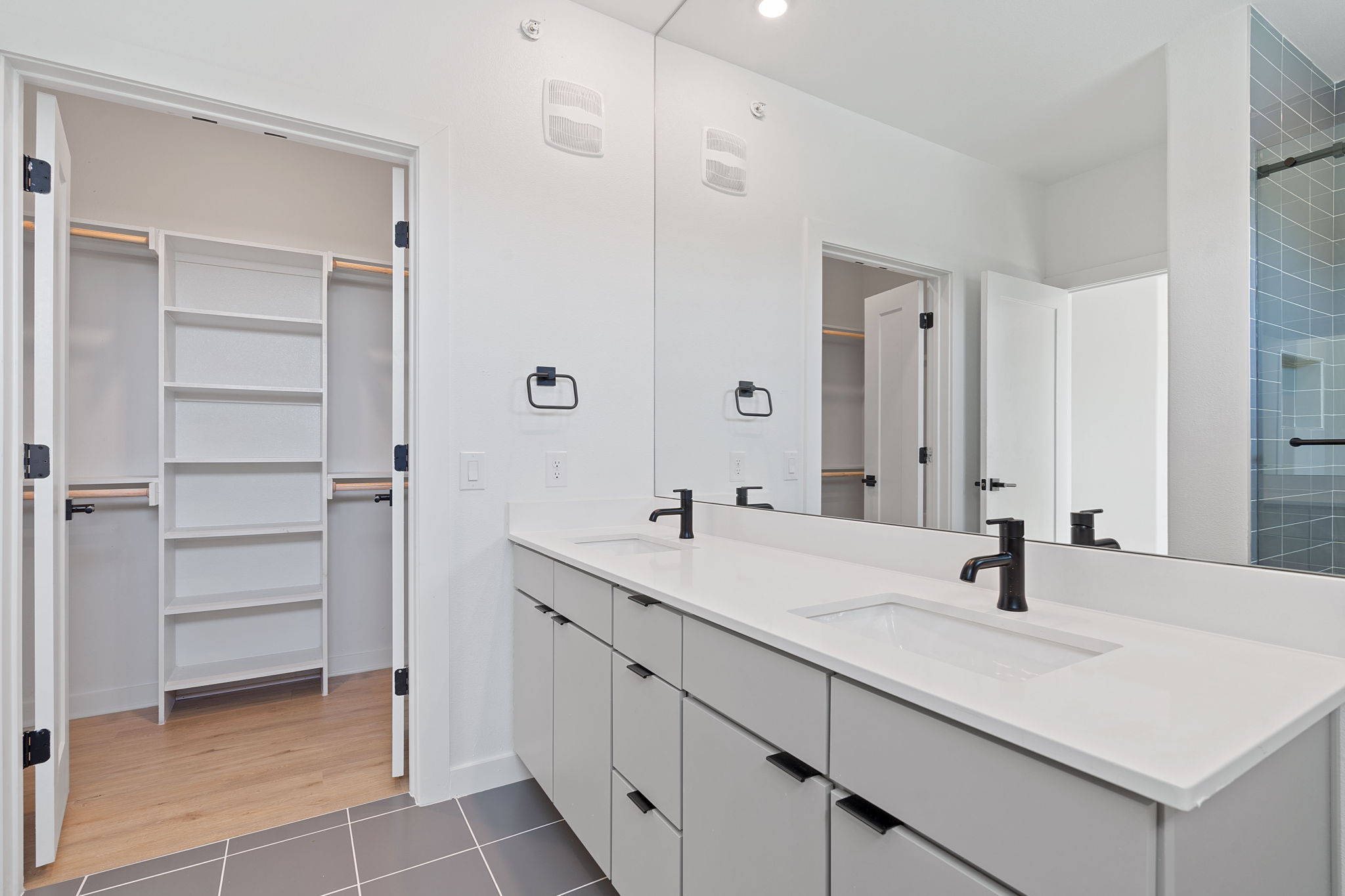 100 West Mockingbird Lane, Unit 307 Austin, TX 78745 - Photo 7 of 23 Full bathroom with double vanity, a spacious closet, tile patterned flooring, and recessed lighting