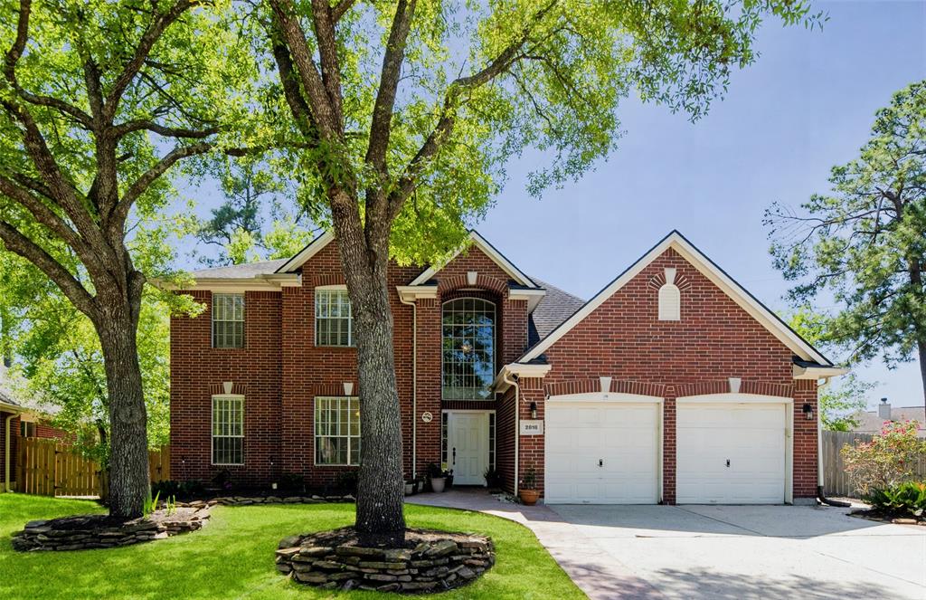 2818 Cottonwood Walk Court Spring, TX 77388 - Photo 1 of 21 a front view of house with a garden