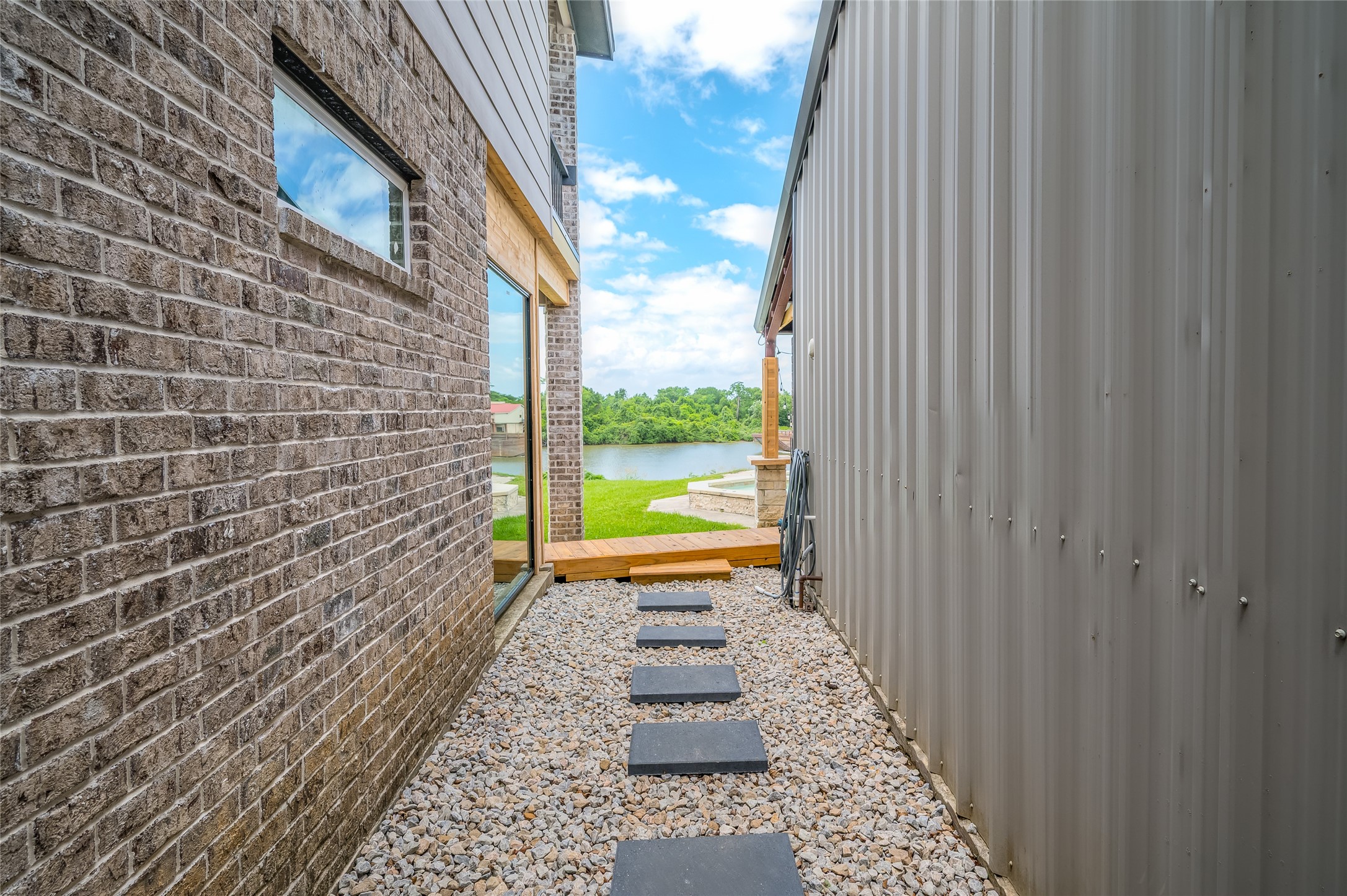 206 Elm Street Highlands, TX 77562 - Photo 18 of 50 walkway in between the house & 3 bay shop