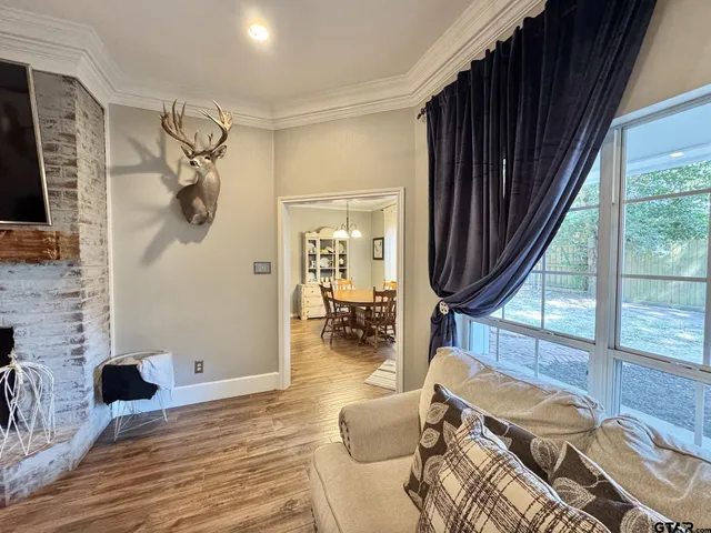 a bedroom with furniture and a window