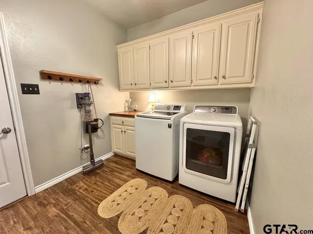 a utility room with sink dryer and washer