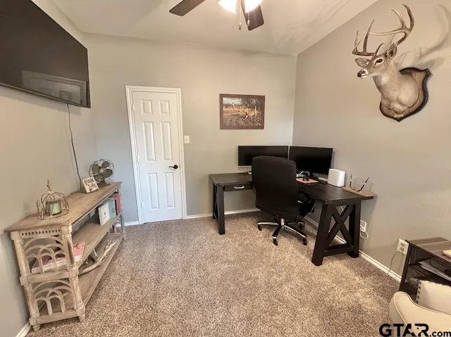 a view of a workspace with furniture