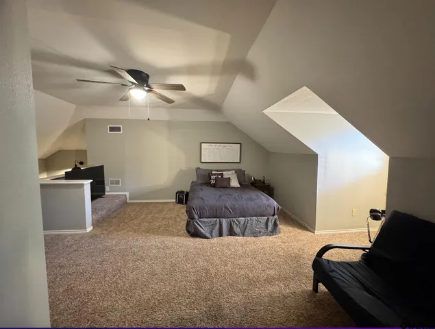 a bedroom with a bed and furniture