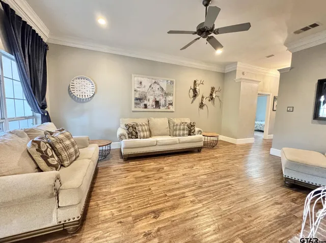 a living room with furniture and a table