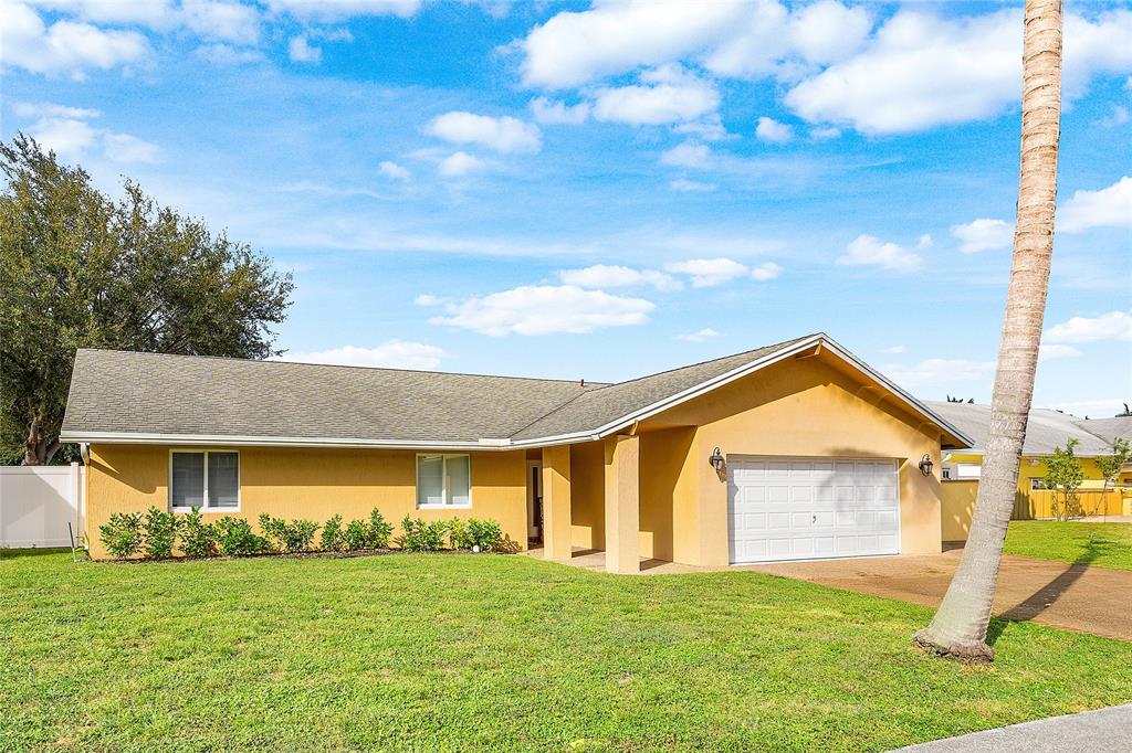 9661 Carousel Circle South Boca Raton, FL 33434 - Photo 1 of 25 a view of a house with yard and a garden