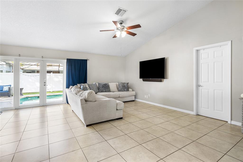 9661 Carousel Circle South Boca Raton, FL 33434 - Photo 11 of 25 a living room with couches and a flat screen tv