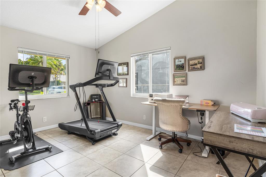 9661 Carousel Circle South Boca Raton, FL 33434 - Photo 14 of 25 a view of a workspace with gym equipment