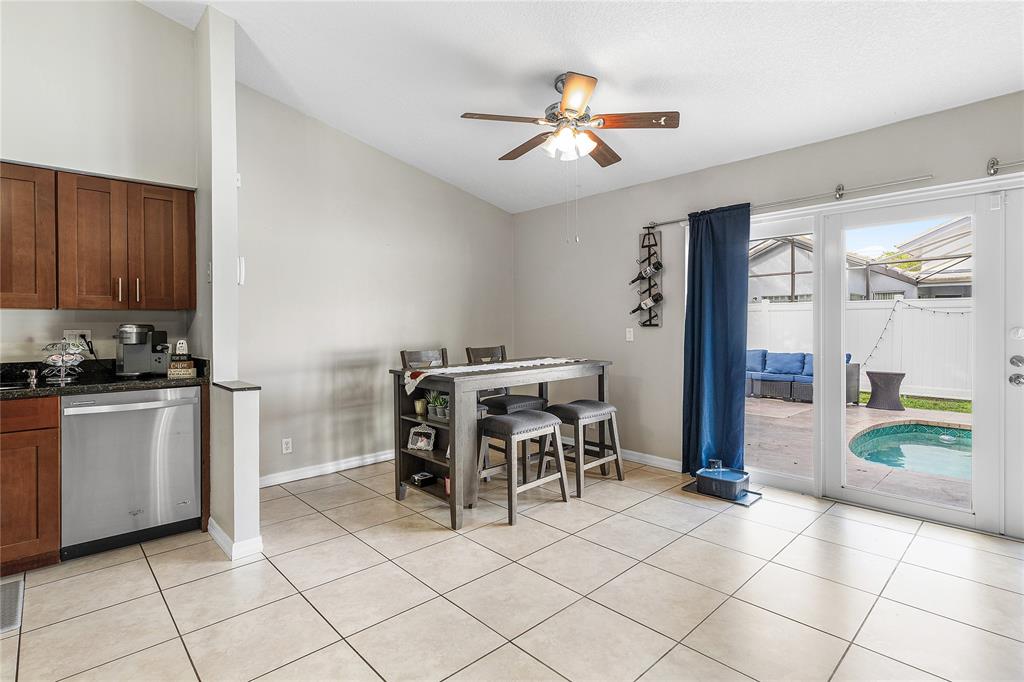 9661 Carousel Circle South Boca Raton, FL 33434 - Photo 9 of 25 a view of a dining room with furniture and chandelier