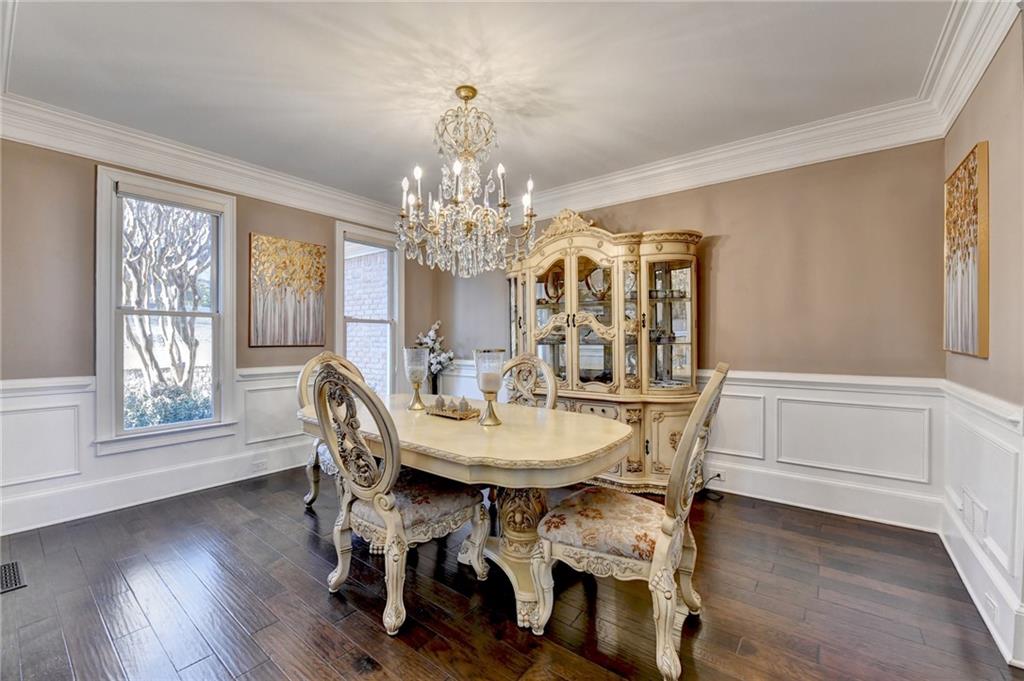 8360 Kenningston Way Duluth, GA 30097 - Photo 12 of 54 a view of a dining room with furniture window and wooden floor