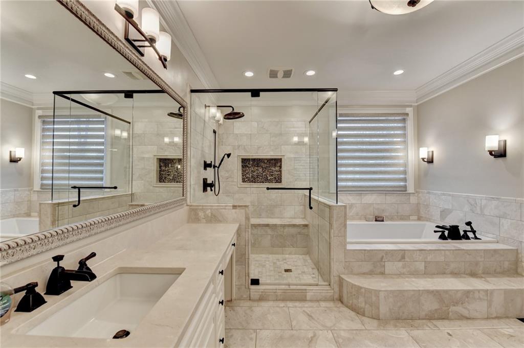 8360 Kenningston Way Duluth, GA 30097 - Photo 26 of 54 a bathroom with a tub a sink and mirror
