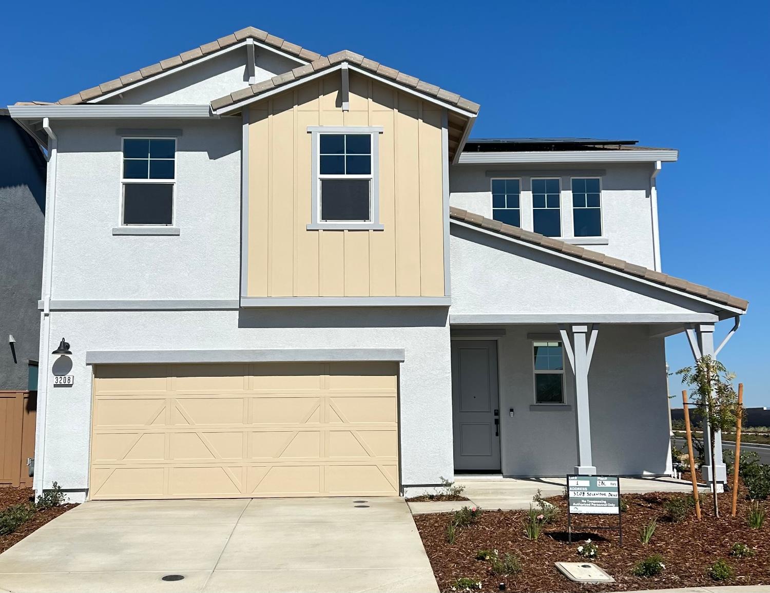a front view of a house with garage