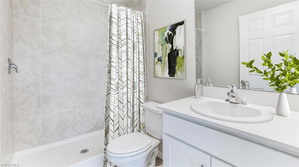 3504 25th Street Southwest Lehigh Acres, FL 33976 - Photo 3 of 10 a bathroom with a sink toilet and shower