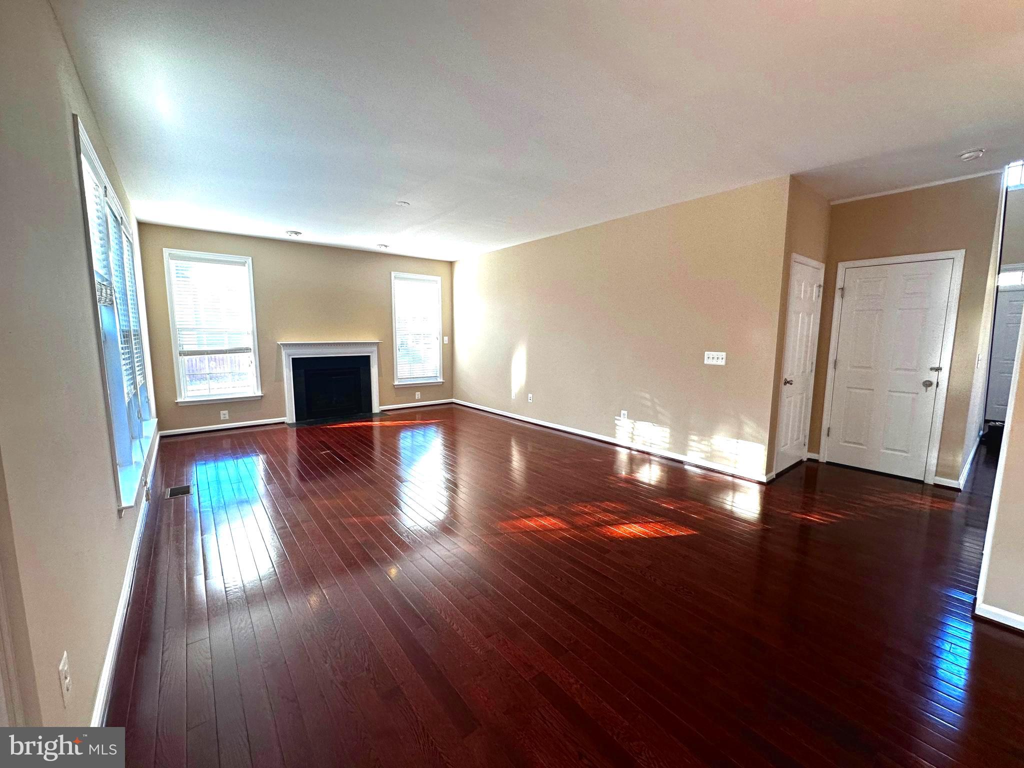 15165 Santander Drive Gainesville, VA 20155 - Photo 15 of 35 a view of an empty room with wooden floor and a window