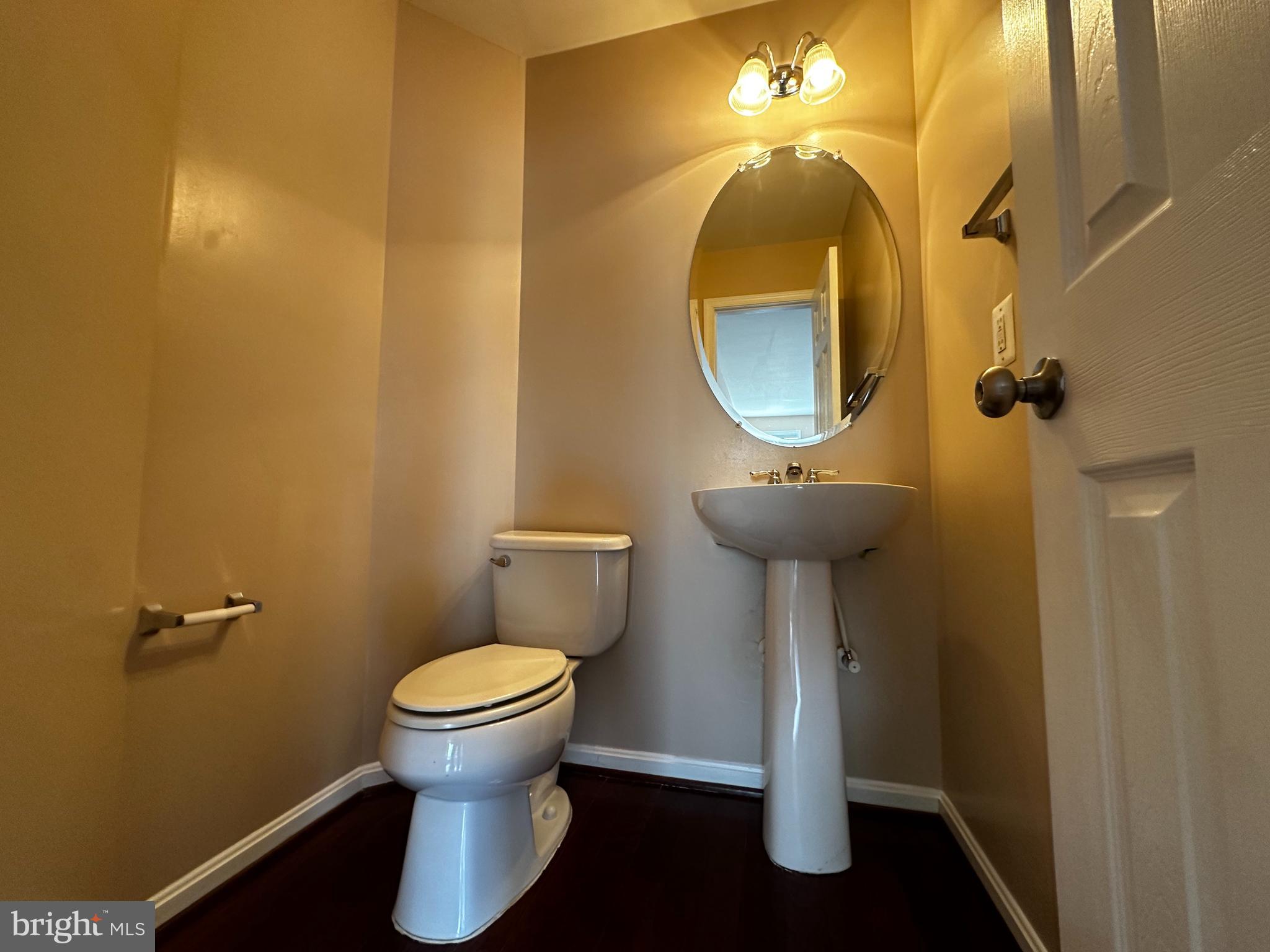 15165 Santander Drive Gainesville, VA 20155 - Photo 17 of 35 a bathroom with a toilet and a mirror