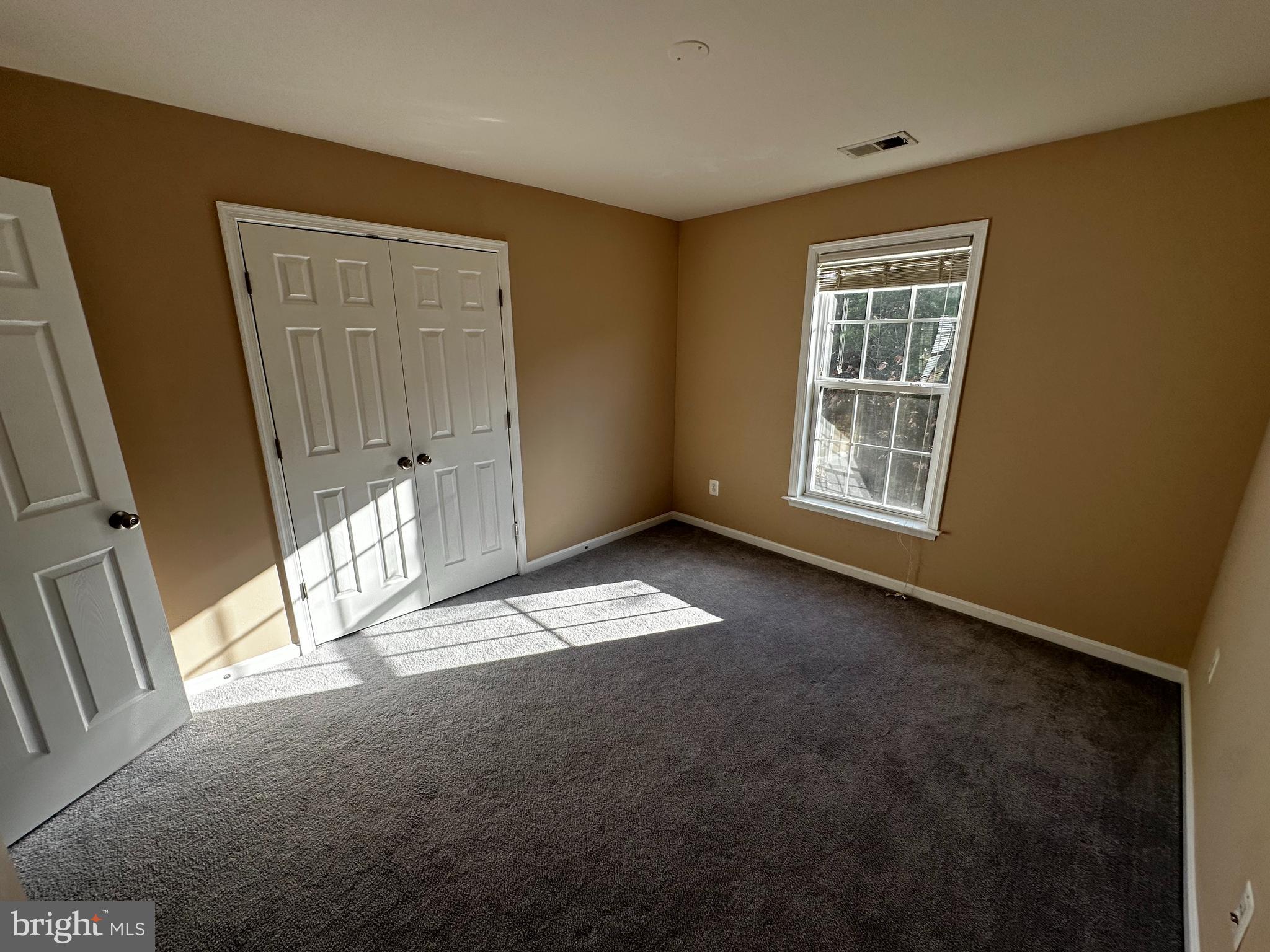 15165 Santander Drive Gainesville, VA 20155 - Photo 31 of 35 an empty room with windows