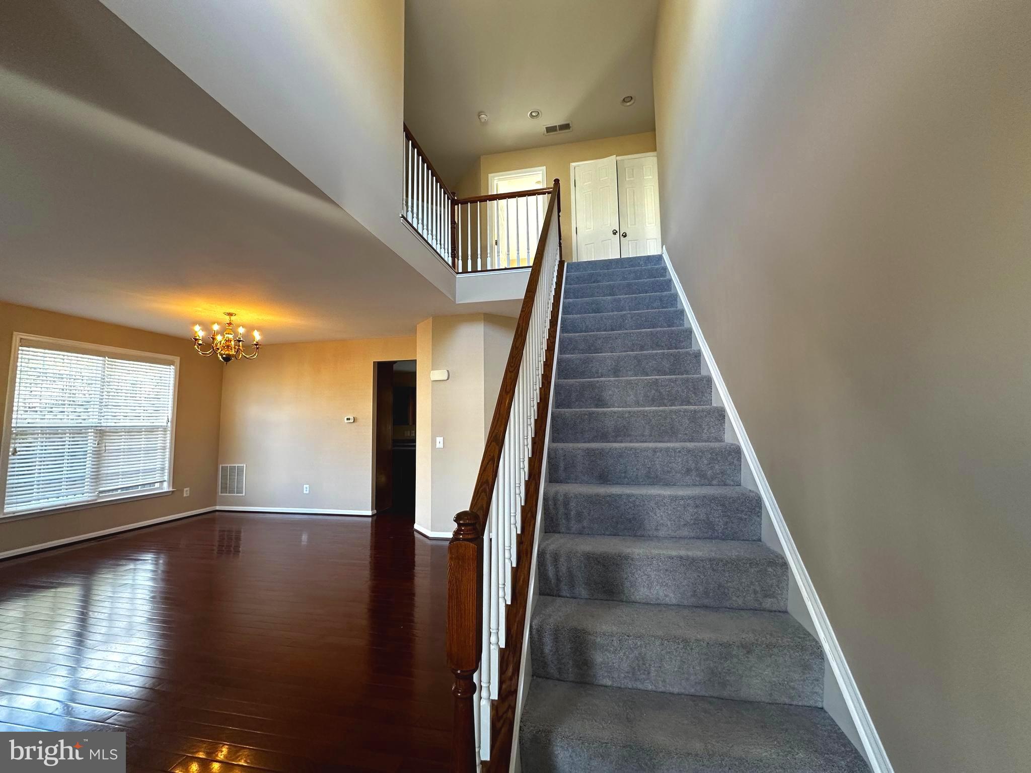 15165 Santander Drive Gainesville, VA 20155 - Photo 5 of 35 a view of entryway and hall with wooden floor