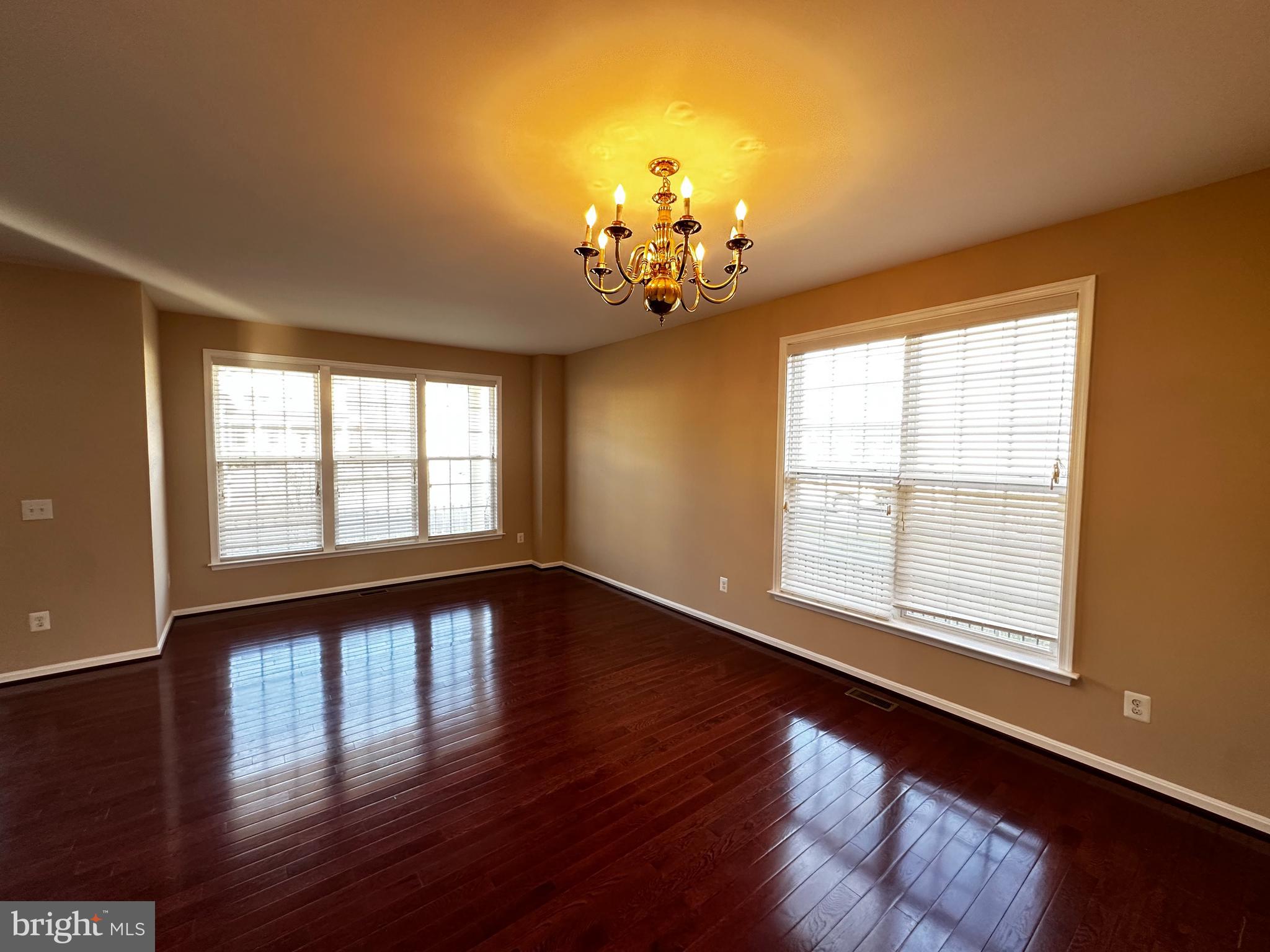 15165 Santander Drive Gainesville, VA 20155 - Photo 8 of 35 a view of an empty room with wooden floor and a window