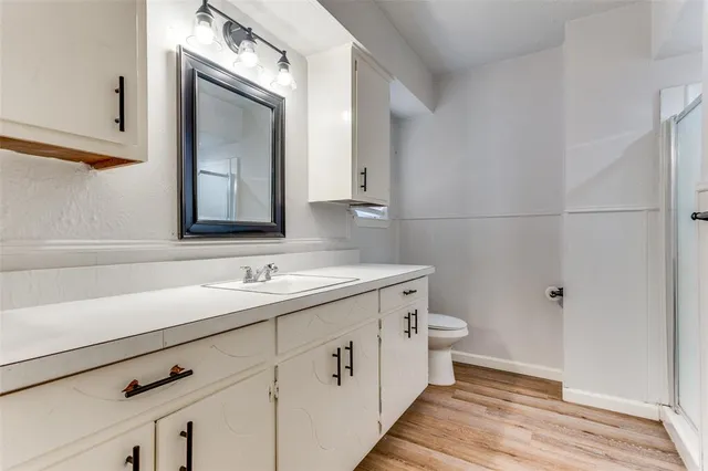 a bathroom with a double vanity sink and mirror