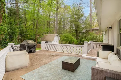 a view of a patio with couches and a fire pit