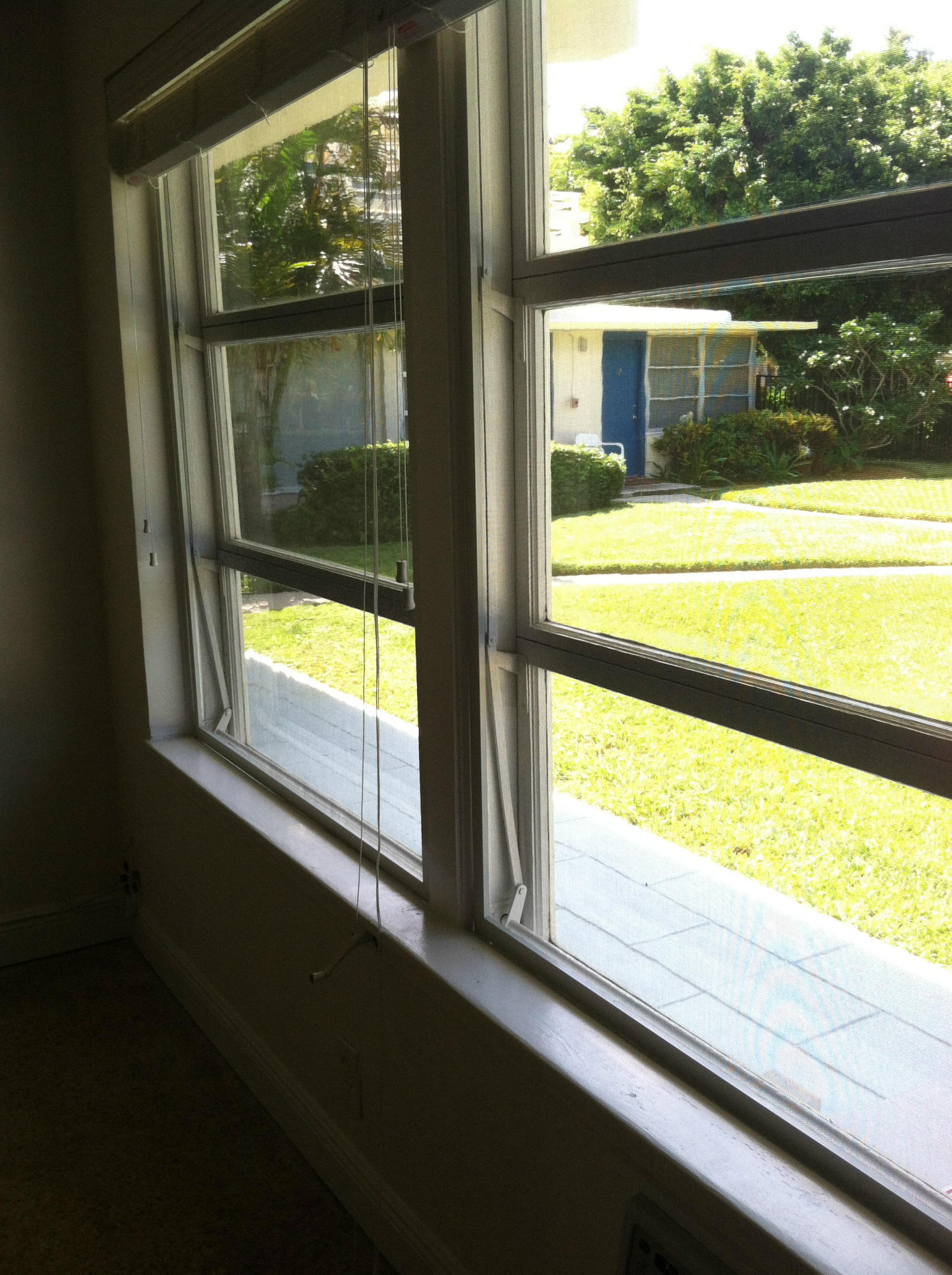 917 Bucida Road, Unit 3 Delray Beach, FL 33483 - Photo 13 of 22 a view of a glass door with a yard from a window