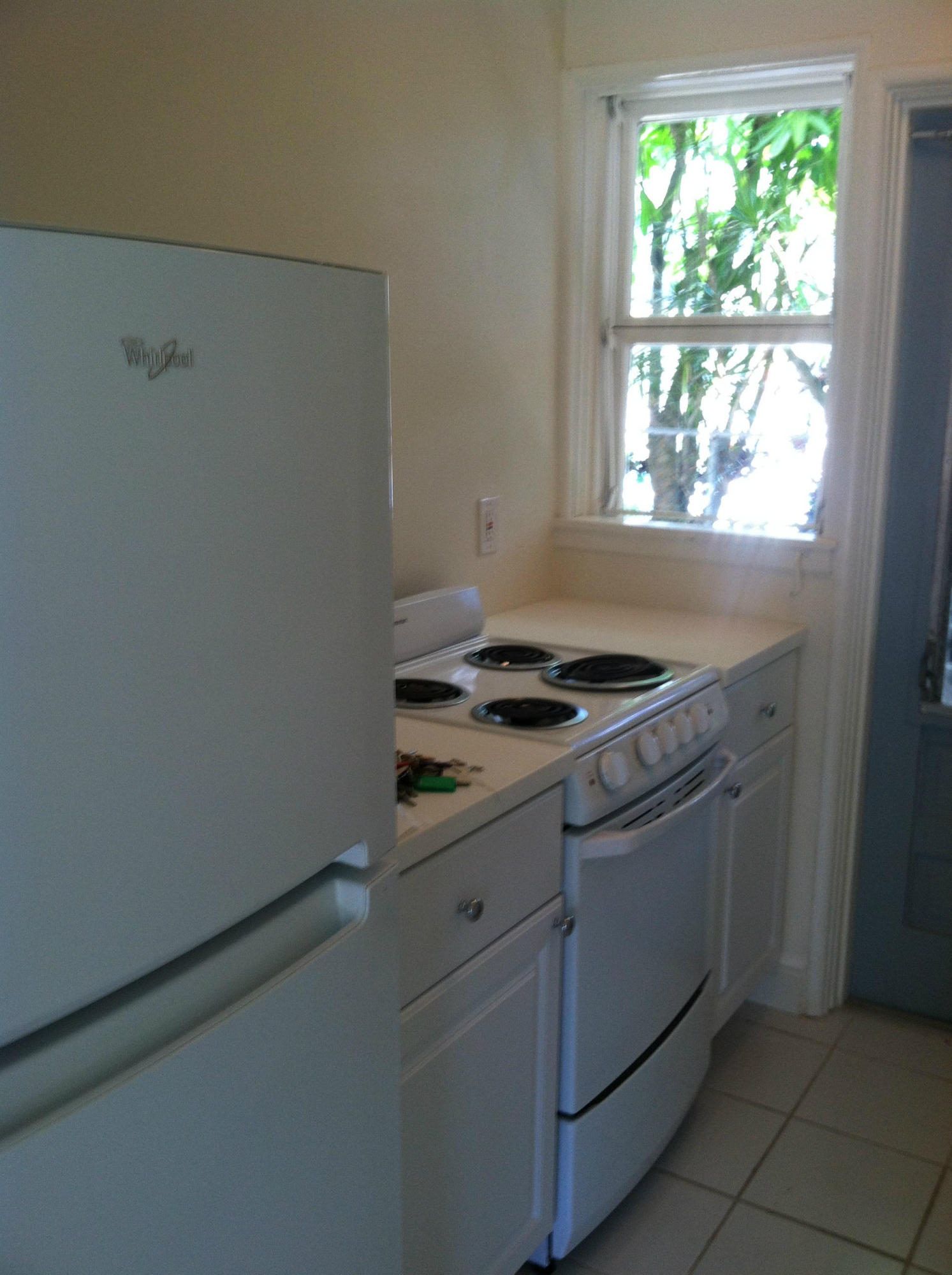 917 Bucida Road, Unit 3 Delray Beach, FL 33483 - Photo 4 of 22 a view of kitchen cabinets and window