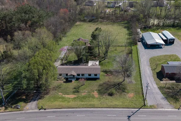 an aerial view of houses with outdoor space