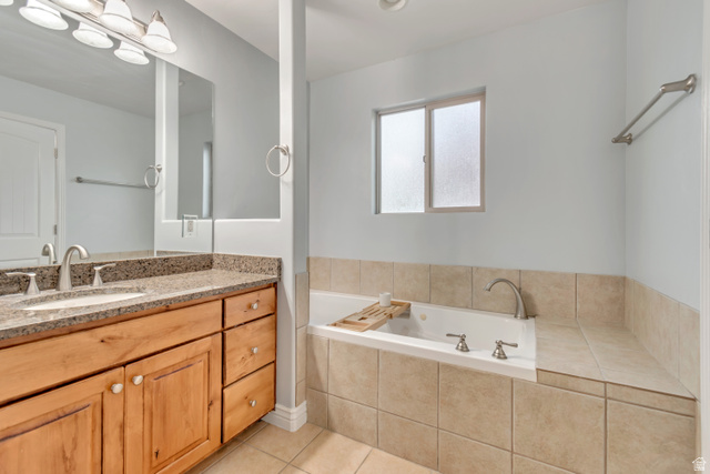 356 North 230 West Payson, UT 84651 - Photo 13 of 45 Bathroom featuring a dual-sink vanity with a granite-style countertop, wood-finish cabinetry, and brushed nickel hardware