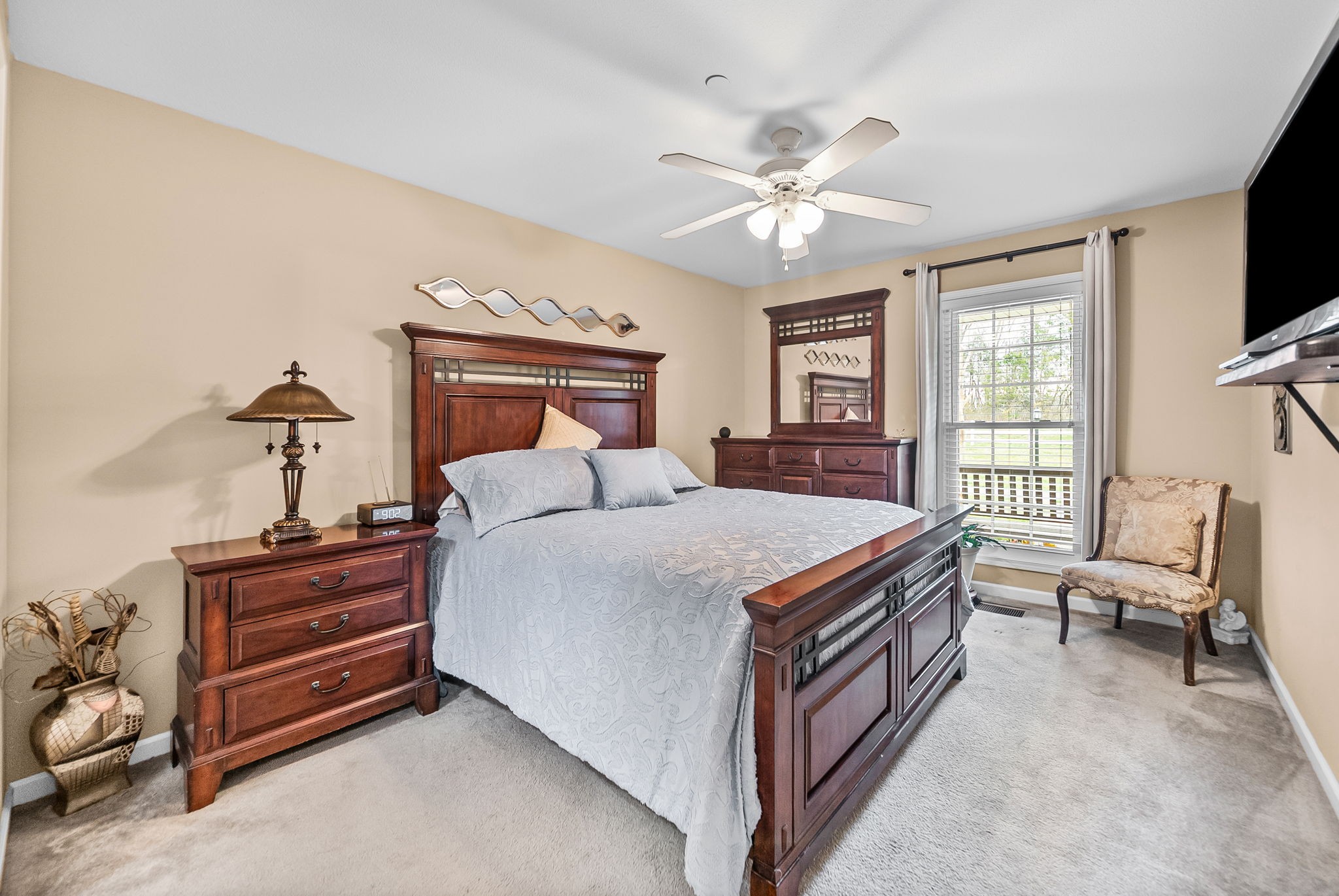 207 Bailey Lane, Unit 102 Pleasant View, TN 37146 - Photo 11 of 30 a bedroom with a bed and a chandelier
