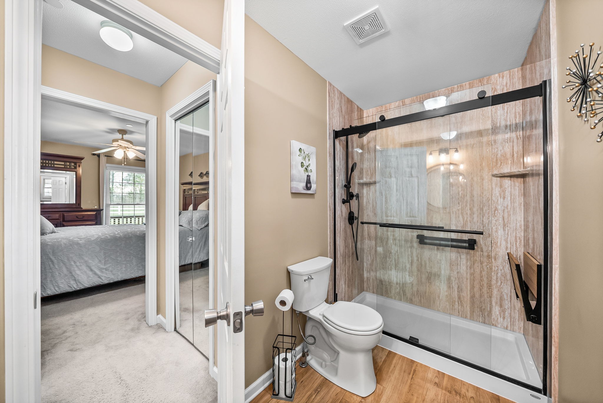207 Bailey Lane, Unit 102 Pleasant View, TN 37146 - Photo 15 of 30 a bathroom with a glass shower door and a toilet