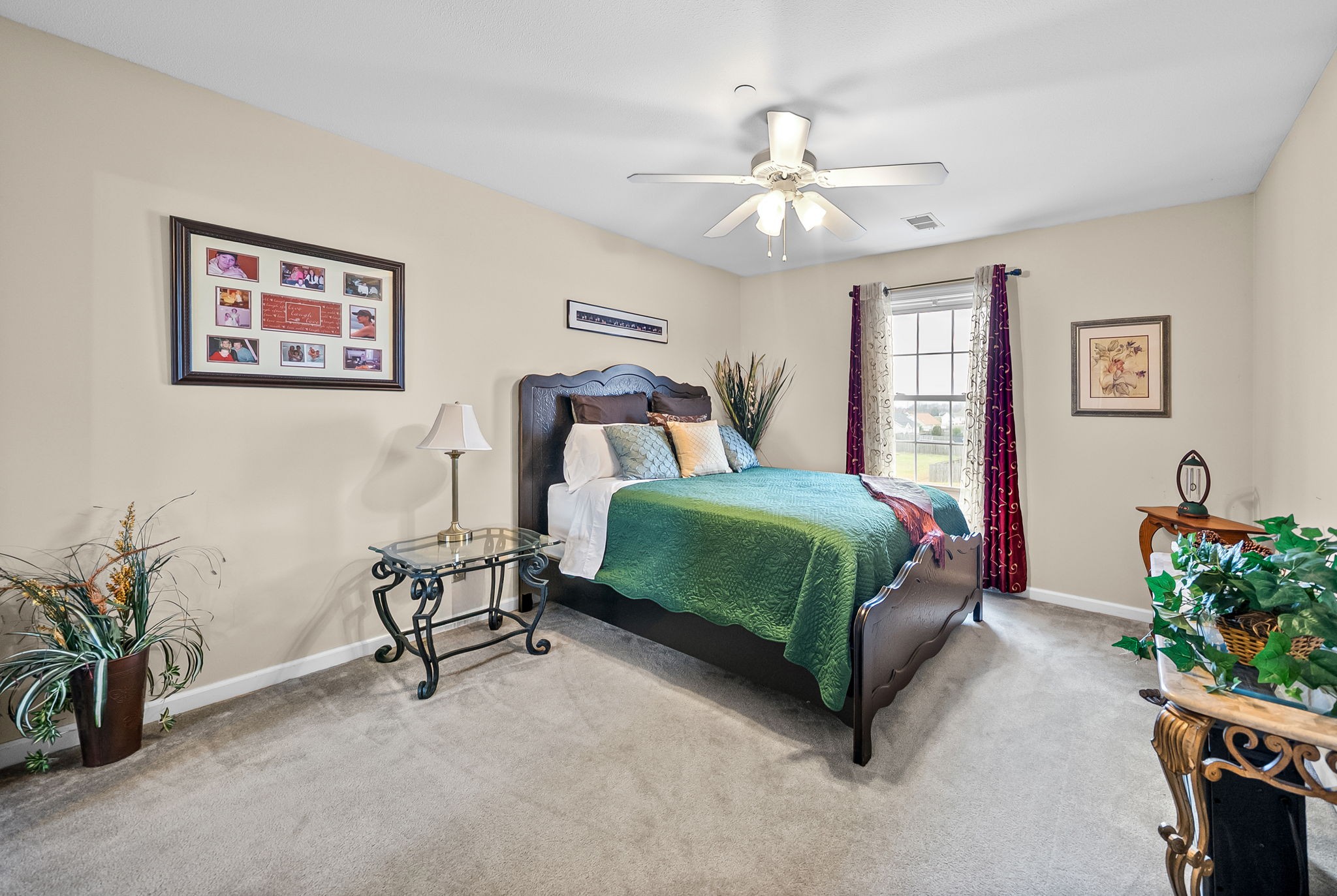207 Bailey Lane, Unit 102 Pleasant View, TN 37146 - Photo 17 of 30 a bedroom with a bed mirror and a potted plant