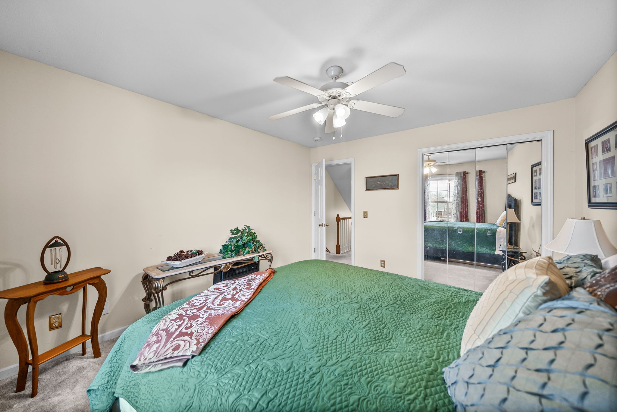 207 Bailey Lane, Unit 102 Pleasant View, TN 37146 - Photo 18 of 30 a bed room with a bed and a chandelier