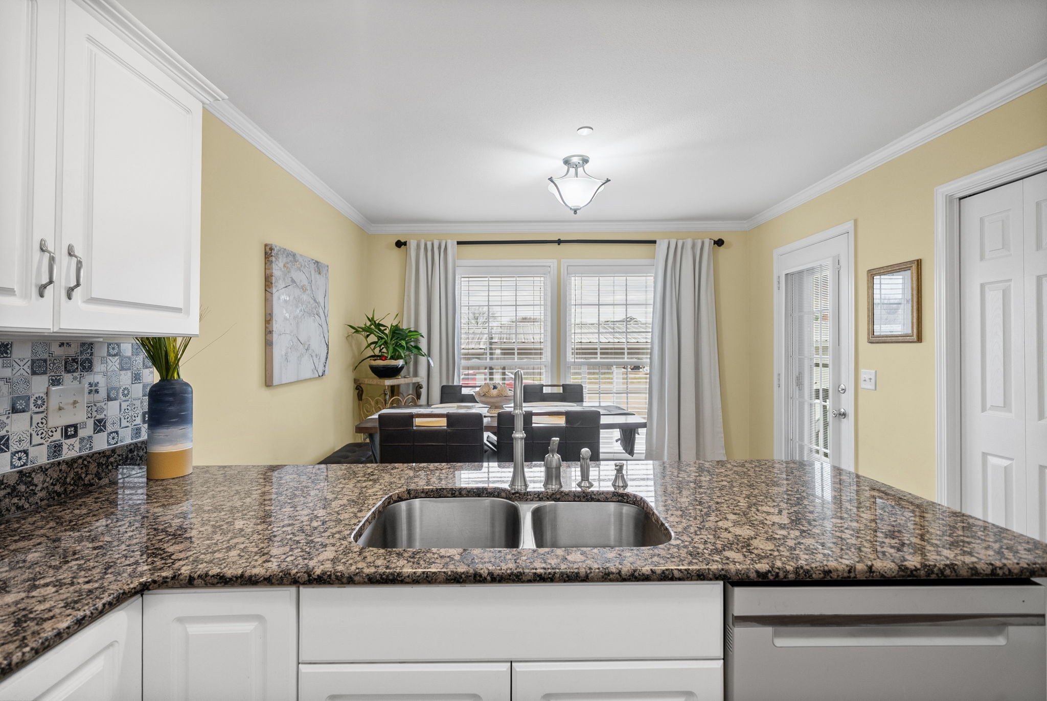 207 Bailey Lane, Unit 102 Pleasant View, TN 37146 - Photo 5 of 30 a kitchen with kitchen island a sink and a counter top space