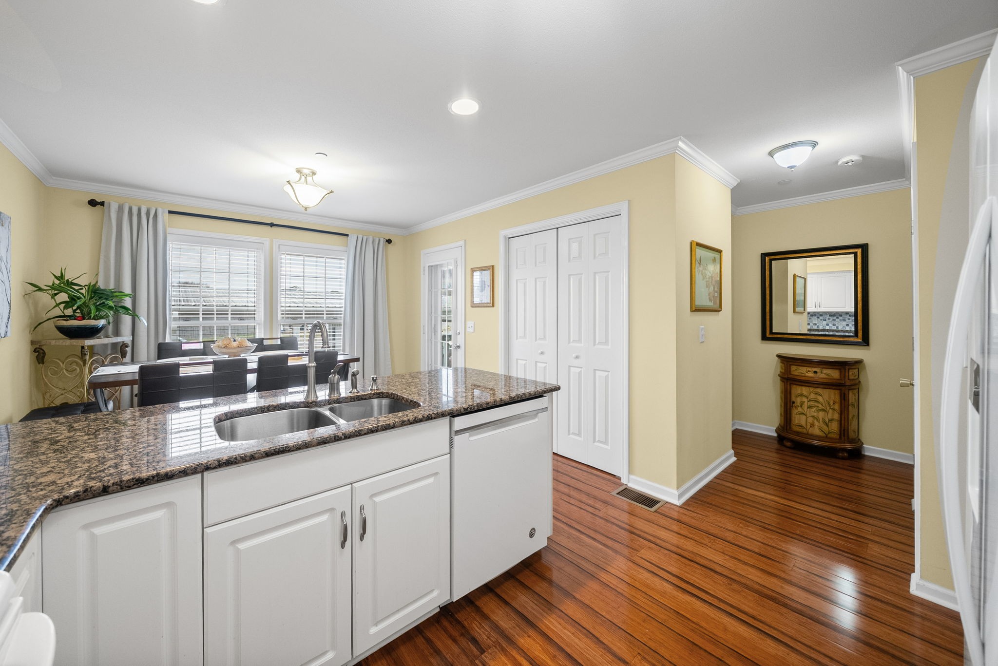 207 Bailey Lane, Unit 102 Pleasant View, TN 37146 - Photo 6 of 30 a kitchen with granite countertop cabinets stainless steel appliances a sink and a large window