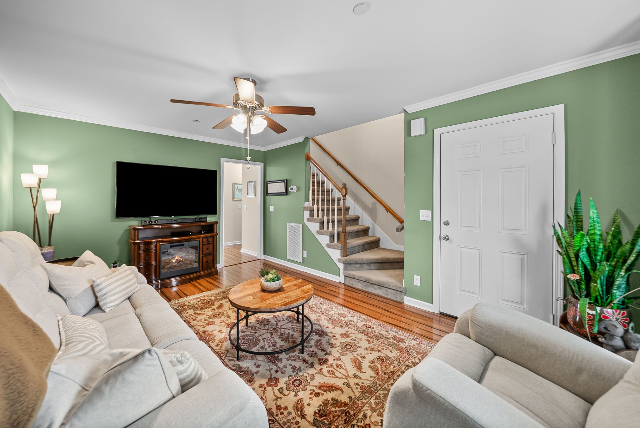 207 Bailey Lane, Unit 102 Pleasant View, TN 37146 - Photo 9 of 30 a living room with furniture and a flat screen tv