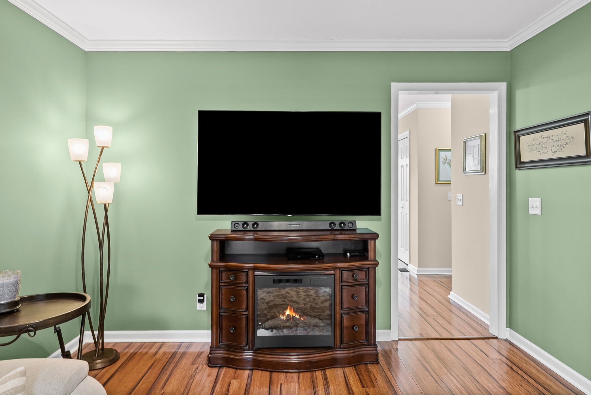 207 Bailey Lane, Unit 102 Pleasant View, TN 37146 - Photo 10 of 30 a living room with a fireplace and a flat screen tv